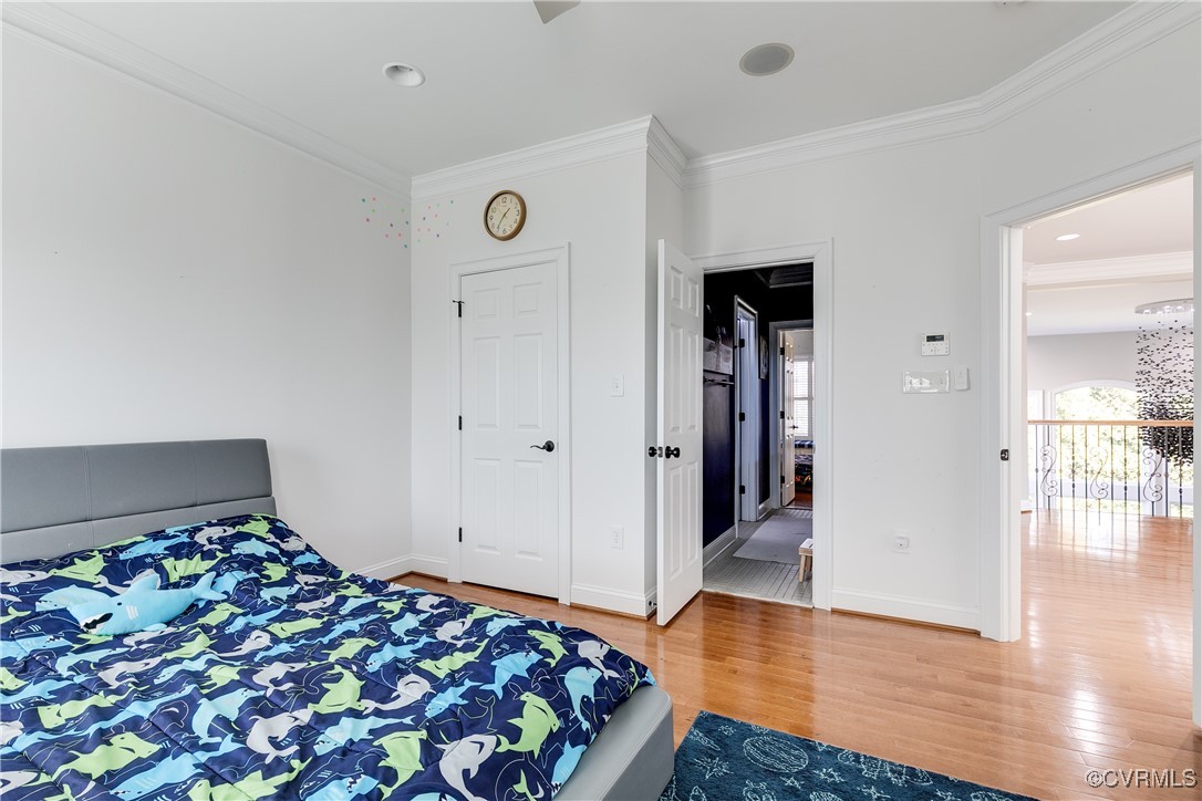 521 Raleigh Manor Road Henrico, VA 23229 - Photo 25 of 46 a bedroom with bed and hardwood floor