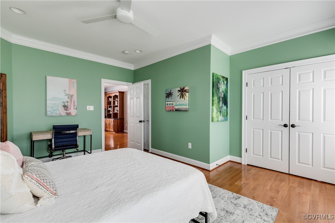 521 Raleigh Manor Road Henrico, VA 23229 - Photo 28 of 46 a bedroom with a bed and wooden floor