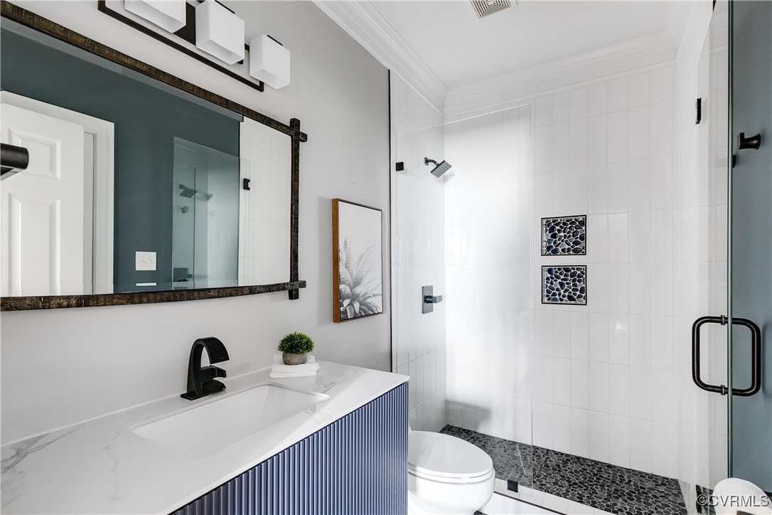 521 Raleigh Manor Road Henrico, VA 23229 - Photo 29 of 46 a bathroom with a sink a toilet a mirror and shower