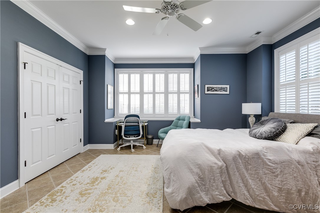 521 Raleigh Manor Road Henrico, VA 23229 - Photo 34 of 46 a bedroom with a bed and a large window