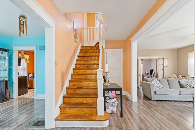 a view of an entryway with wooden floor and windows