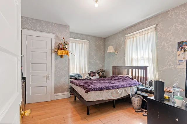 a bed room with a bed and window