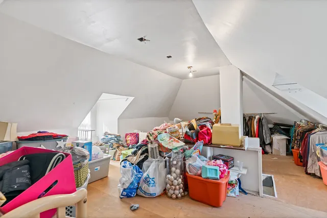 a bed room with a bed and a desk