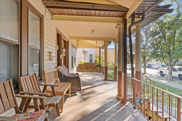 a view of an chairs and table in the balcony