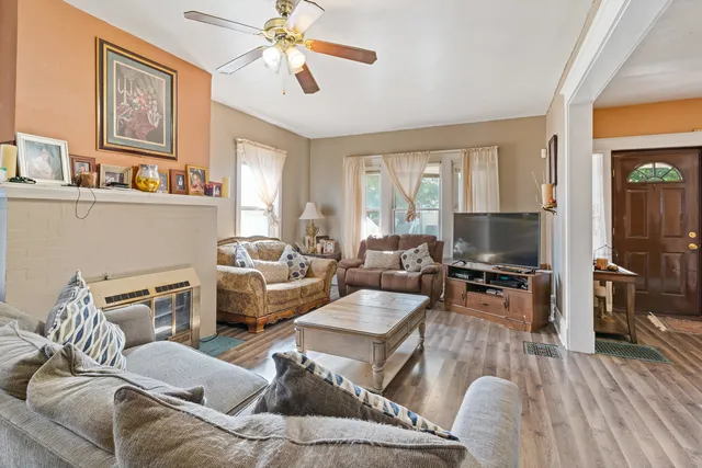 a living room with furniture or couch and a flat screen tv