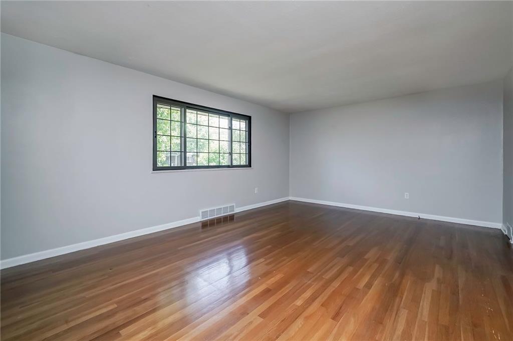 208 Lytton Road Coraopolis, PA 15108 - Photo 3 of 25 Living Room with Oversized Picture Window that Emits Loads of Natural Lighting