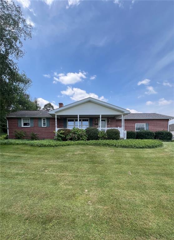 383 Bonniebrook Road Butler, PA 16002 - Photo 1 of 25 a front view of a house with a garden