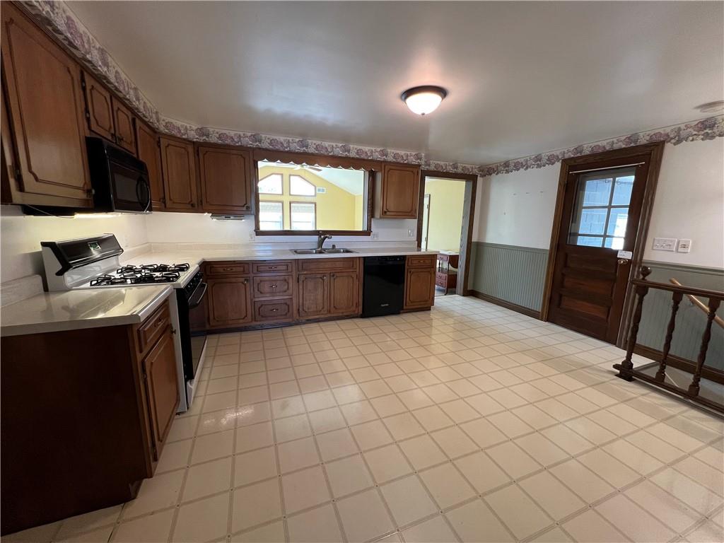 383 Bonniebrook Road Butler, PA 16002 - Photo 13 of 25 a kitchen with stainless steel appliances a stove a sink and a refrigerator