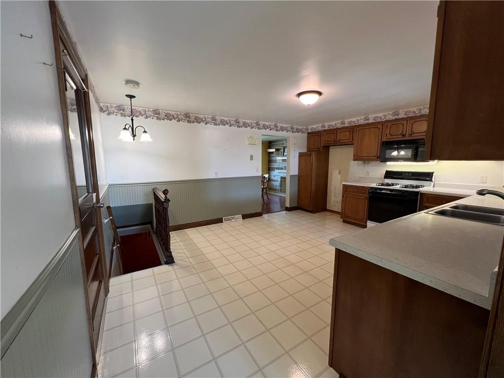 383 Bonniebrook Road Butler, PA 16002 - Photo 15 of 25 a kitchen with a sink appliances and cabinets