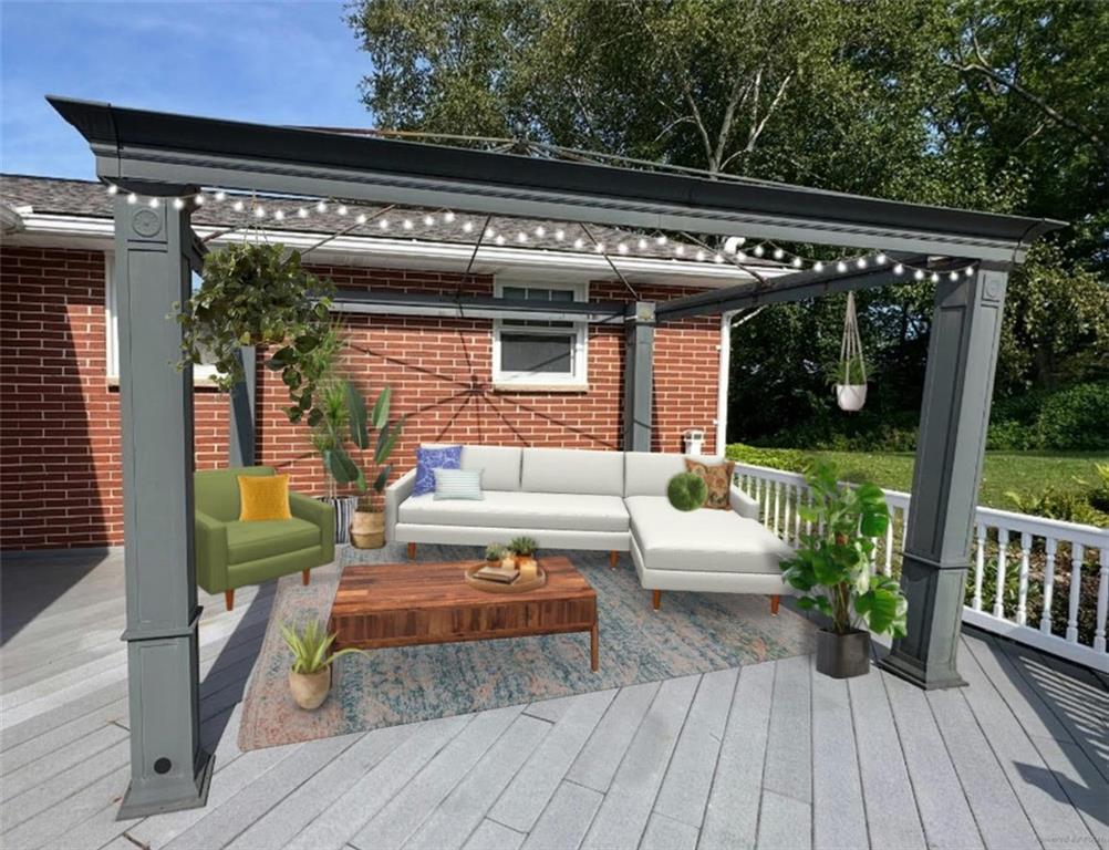 383 Bonniebrook Road Butler, PA 16002 - Photo 24 of 25 a view of a patio with table and chairs potted plants with wooden floor and fence