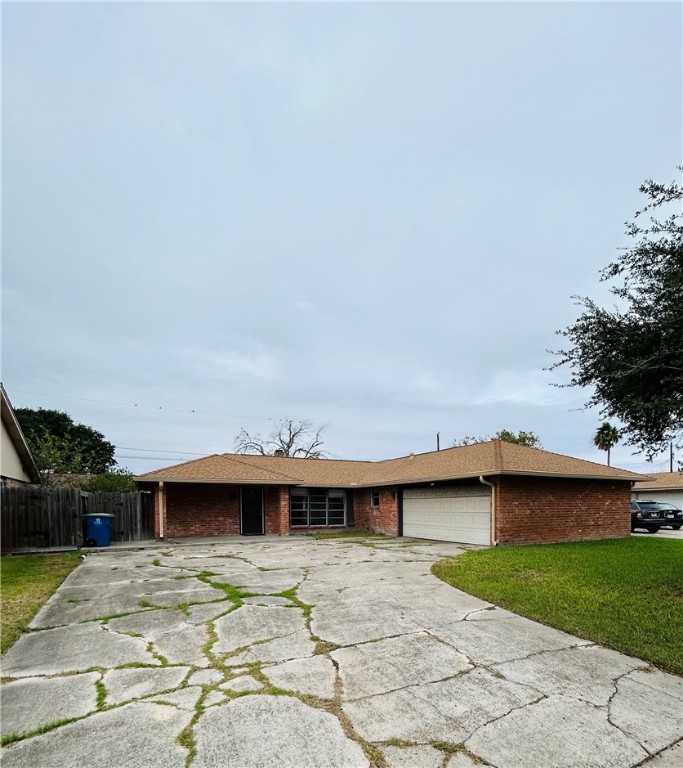 1613 Cheyenne Street Portland, TX 78374 - Photo 2 of 25 a view of a house with a patio and a yard