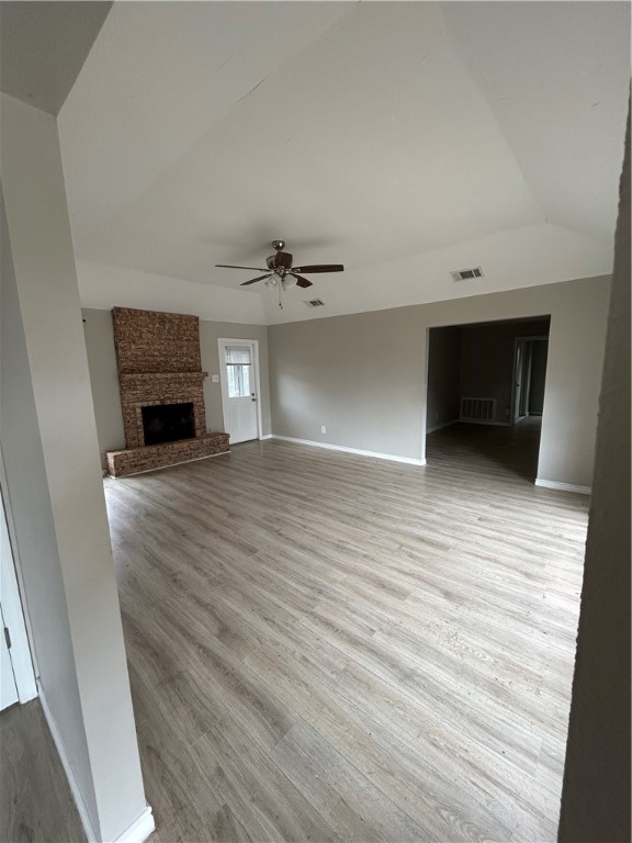 1613 Cheyenne Street Portland, TX 78374 - Photo 5 of 25 wooden floor in an empty room with a fireplace