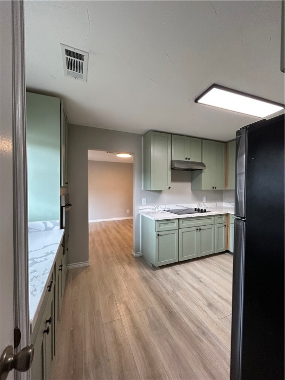 1613 Cheyenne Street Portland, TX 78374 - Photo 10 of 25 a kitchen with stainless steel appliances kitchen island granite countertop a sink and cabinets