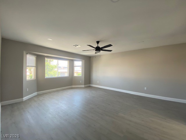 3702 River Canyon Road Las Vegas, NV 89129 - Photo 14 of 35 Unfurnished room featuring light wood-type flooring and ceiling fan