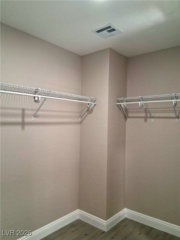 3702 River Canyon Road Las Vegas, NV 89129 - Photo 18 of 35 Spacious closet featuring wood finished floors