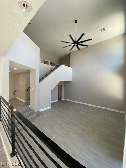 3702 River Canyon Road Las Vegas, NV 89129 - Photo 23 of 35 Unfurnished living room featuring light wood-style floors, a ceiling fan, and recessed lighting