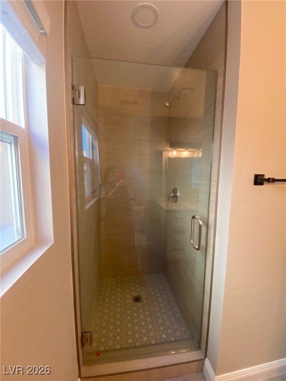 3702 River Canyon Road Las Vegas, NV 89129 - Photo 31 of 35 Bathroom with a stall shower and tile patterned floors