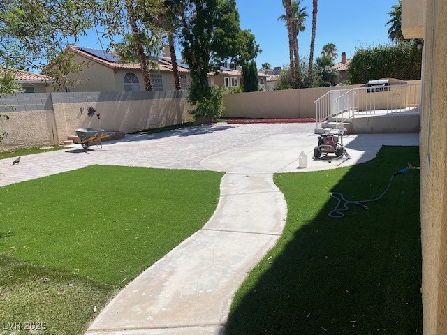 3702 River Canyon Road Las Vegas, NV 89129 - Photo 33 of 35 Fenced backyard with a patio and a wooden deck