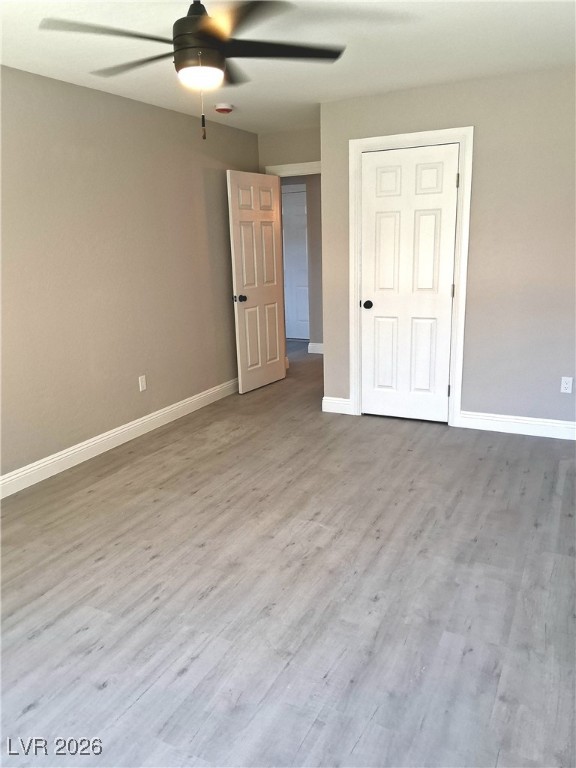 3702 River Canyon Road Las Vegas, NV 89129 - Photo 35 of 35 Unfurnished bedroom with a ceiling fan and light wood finished floors
