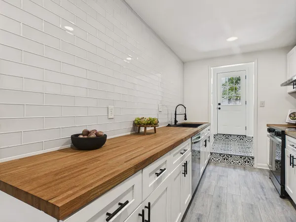 a kitchen with a sink and cabinets