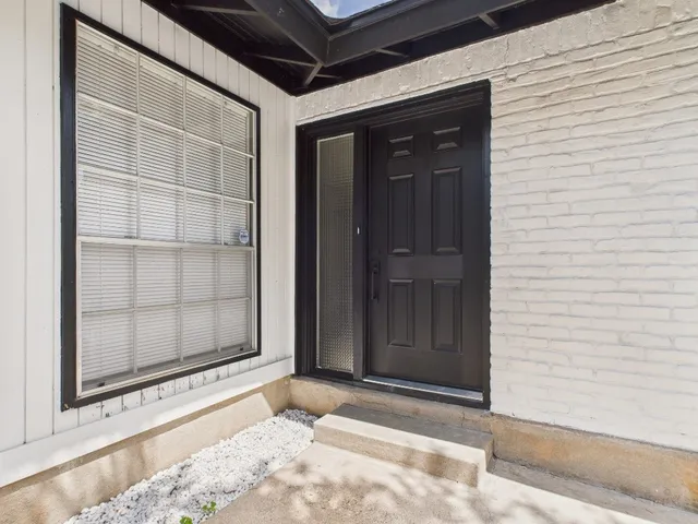 a picture of a room with a floor to ceiling window