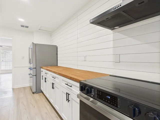 a spacious bathroom with a sink and a washing machine