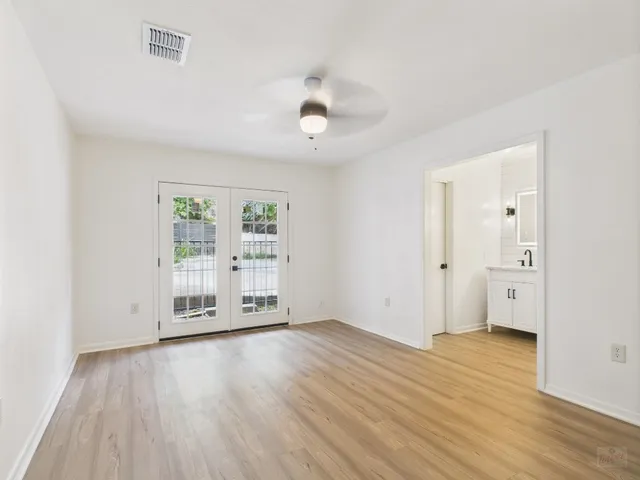 a kitchen with stainless steel appliances a sink and cabinets