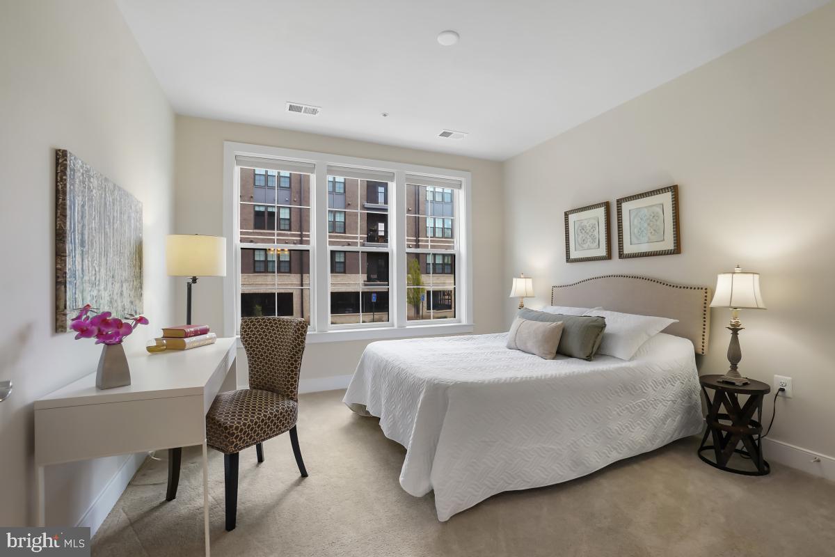 2319 Field Point Road, Unit 107 Herndon, VA 20171 - Photo 18 of 30 a bedroom with a bed furniture and decor