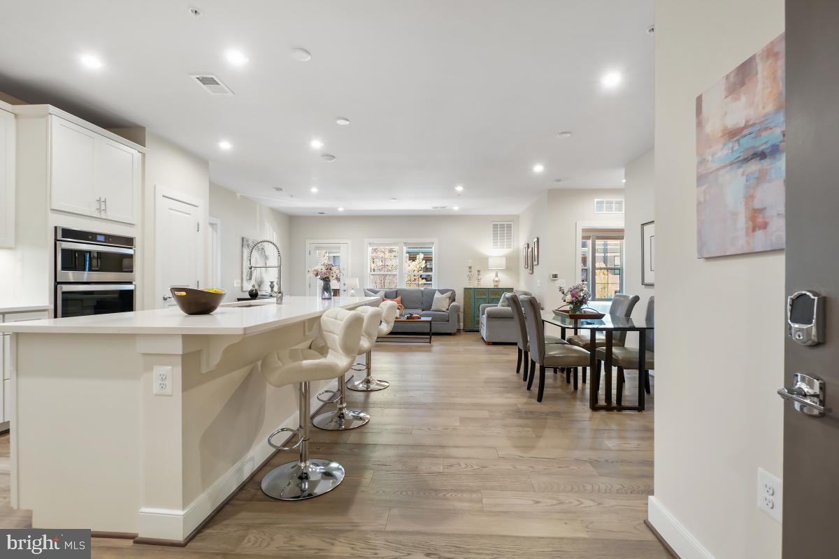 2319 Field Point Road, Unit 107 Herndon, VA 20171 - Photo 2 of 30 a kitchen with lots of counter space and furniture