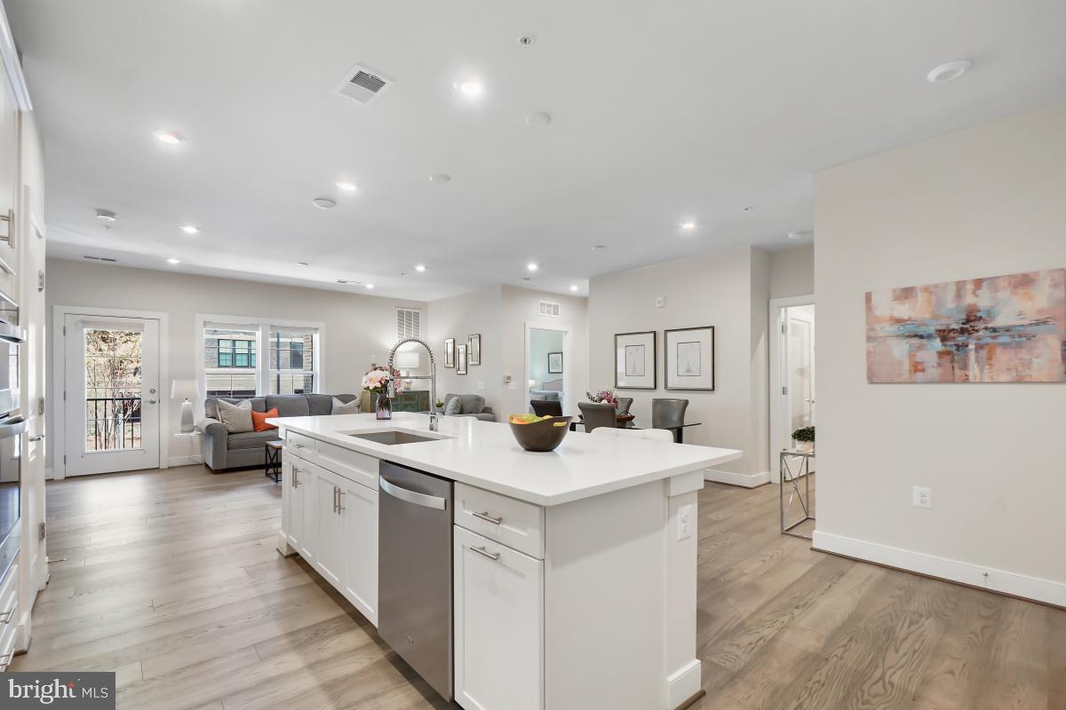 2319 Field Point Road, Unit 107 Herndon, VA 20171 - Photo 6 of 30 a view of a kitchen and living room
