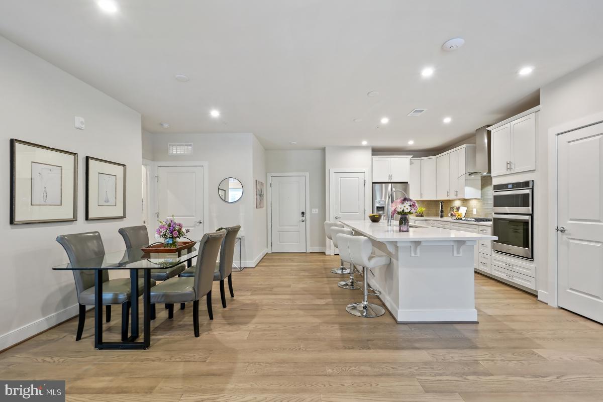 2319 Field Point Road, Unit 107 Herndon, VA 20171 - Photo 7 of 30 a large kitchen with table and chairs