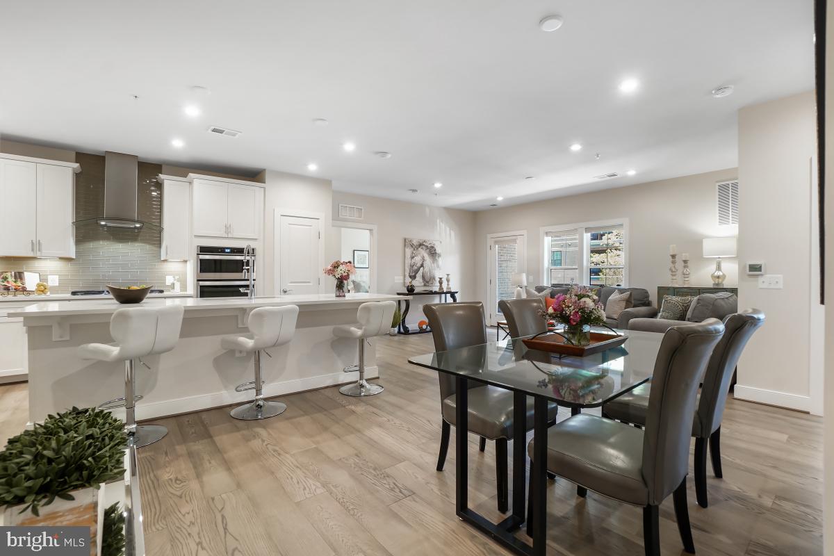2319 Field Point Road, Unit 107 Herndon, VA 20171 - Photo 9 of 30 a view of kitchen with dining table and chairs