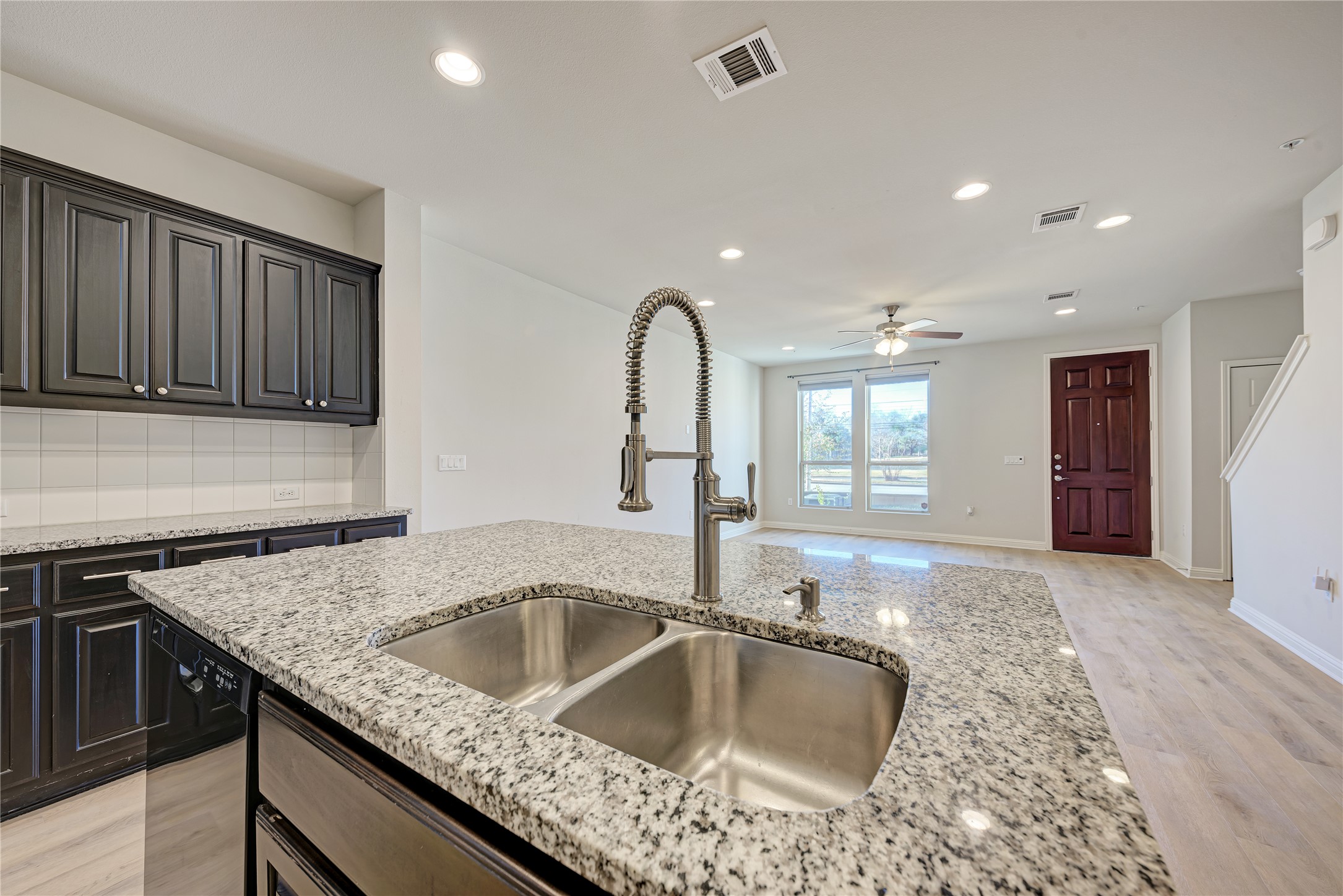 6814 East Riverside Drive, Unit 32 Austin, TX 78741 - Photo 24 of 26 a kitchen with a sink granite top and outdoor space