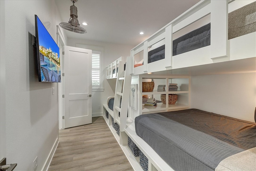 204 Round Road Port Aransas, TX 78373 - Photo 11 of 33 a view of a bedroom with furniture and windows