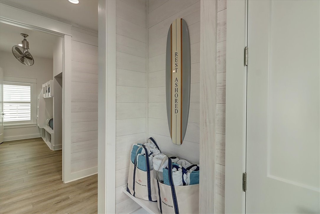 204 Round Road Port Aransas, TX 78373 - Photo 13 of 33 a view of a hallway with wooden floor and staircase