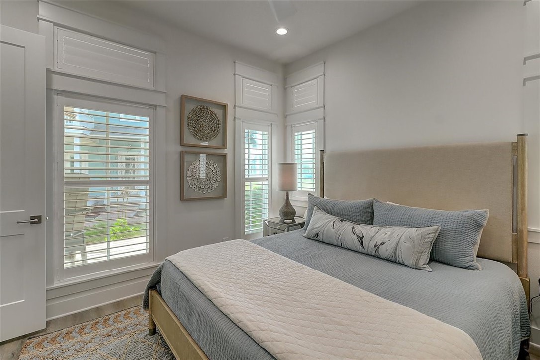 204 Round Road Port Aransas, TX 78373 - Photo 14 of 33 a bedroom with a large bed and a window