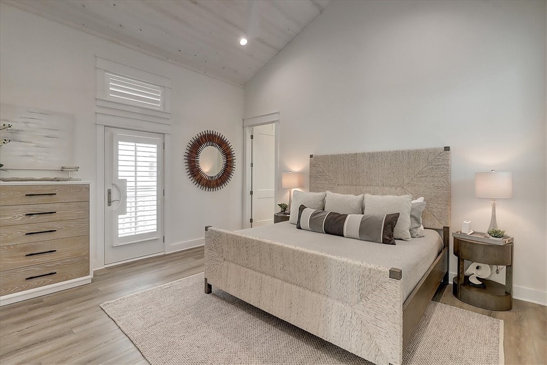 204 Round Road Port Aransas, TX 78373 - Photo 22 of 33 a bed room with a bed and a window