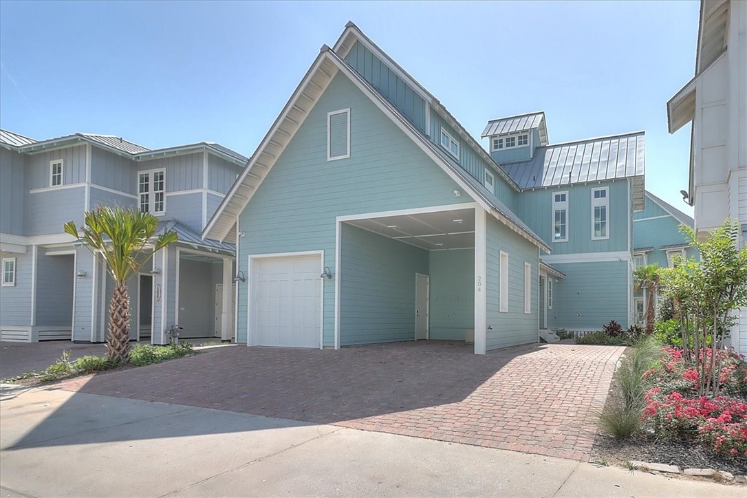 204 Round Road Port Aransas, TX 78373 - Photo 27 of 33 a front view of a house with plants