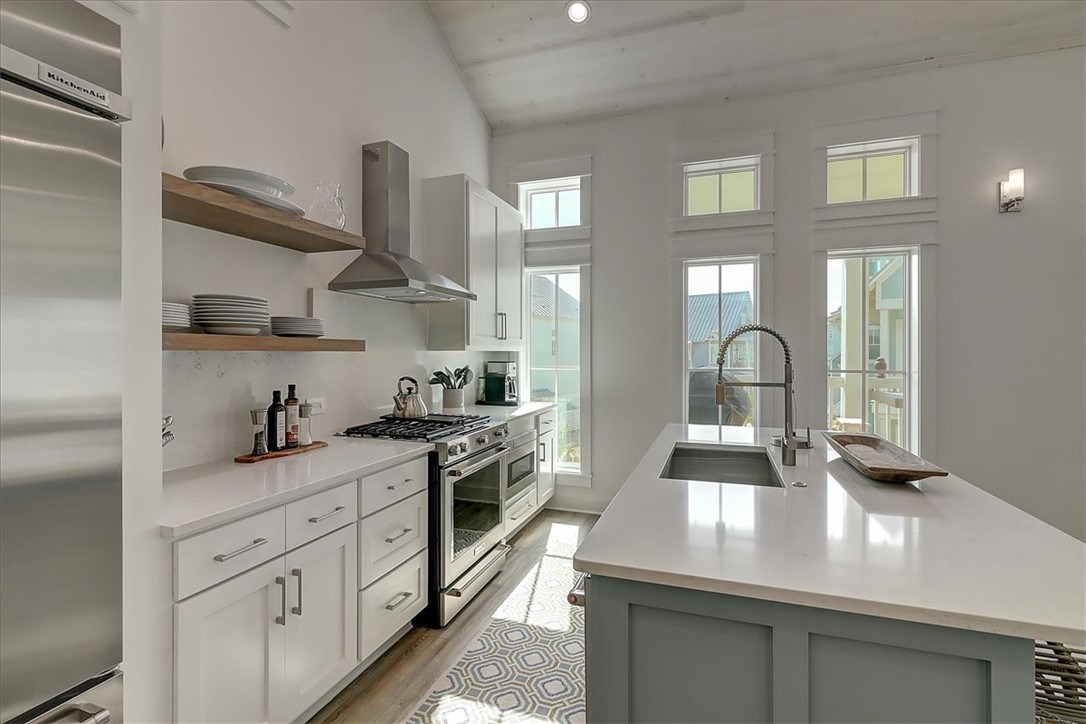 204 Round Road Port Aransas, TX 78373 - Photo 3 of 33 a kitchen with cabinets and appliances