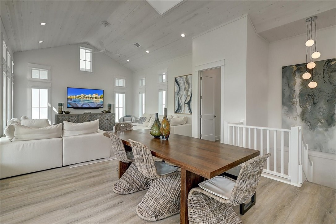 204 Round Road Port Aransas, TX 78373 - Photo 5 of 33 a dining room with furniture and wooden floor