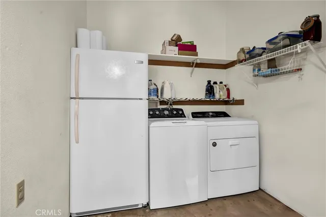 a white refrigerator freezer sitting inside of a kitchen