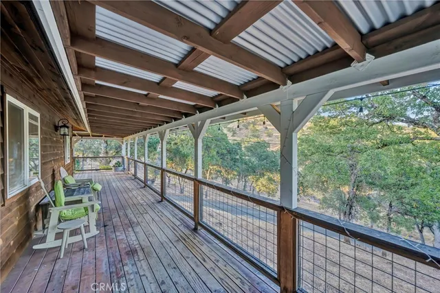 a view of porch with wooden floor