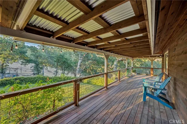 a view of balcony with wooden floor