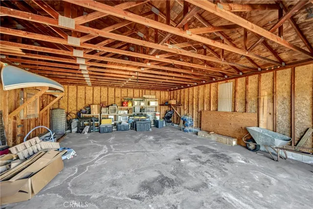 a view of a house with a yard and tree s