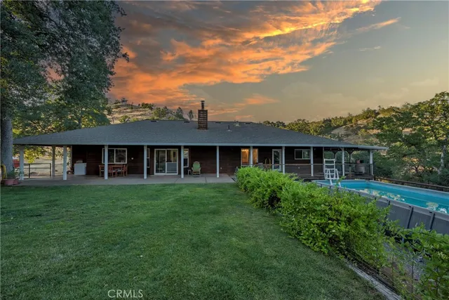 a view of a big house with garden