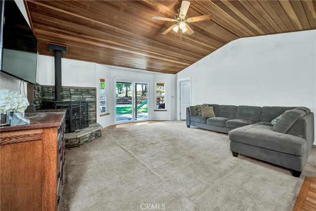 a living room with furniture a fireplace and a counter top space
