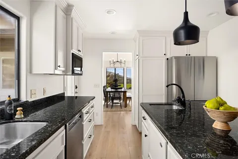 a front view of a house with a yard garage and outdoor seating