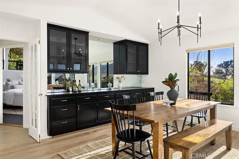 a bedroom with a large bed and a large window