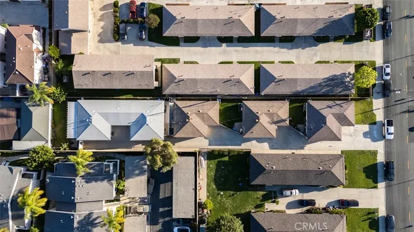 an aerial view of multiple houses with outdoor space