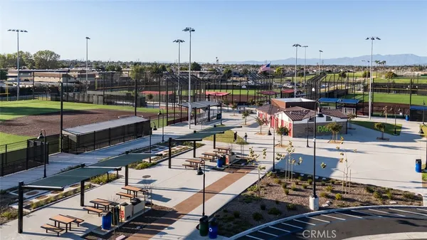a roof deck with table and chairs potted plants